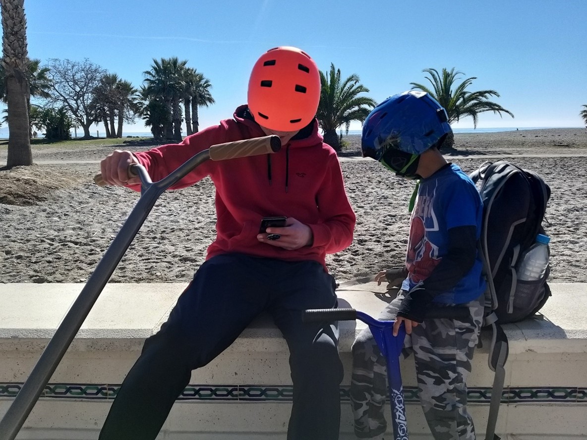 trust child on a beach scooter photo